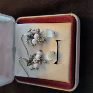 Silver and white beaded dangle earrings.